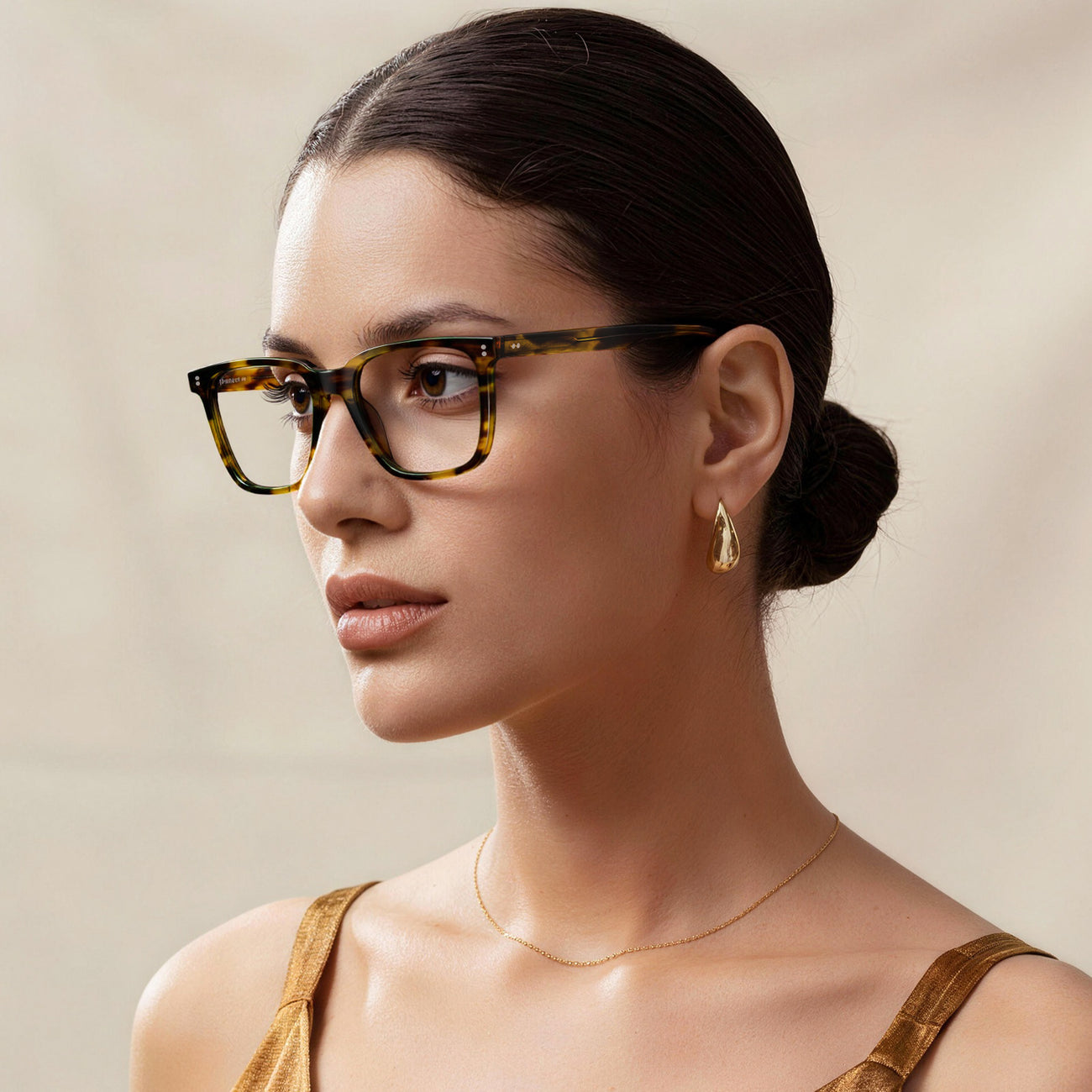 Model wearing amber frames
